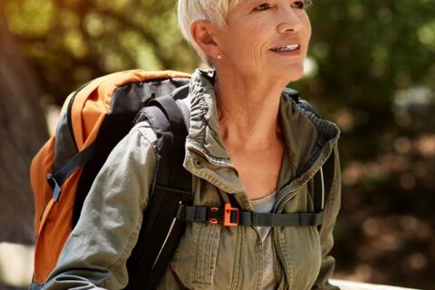 senior woman enjoying a hike outdoors
